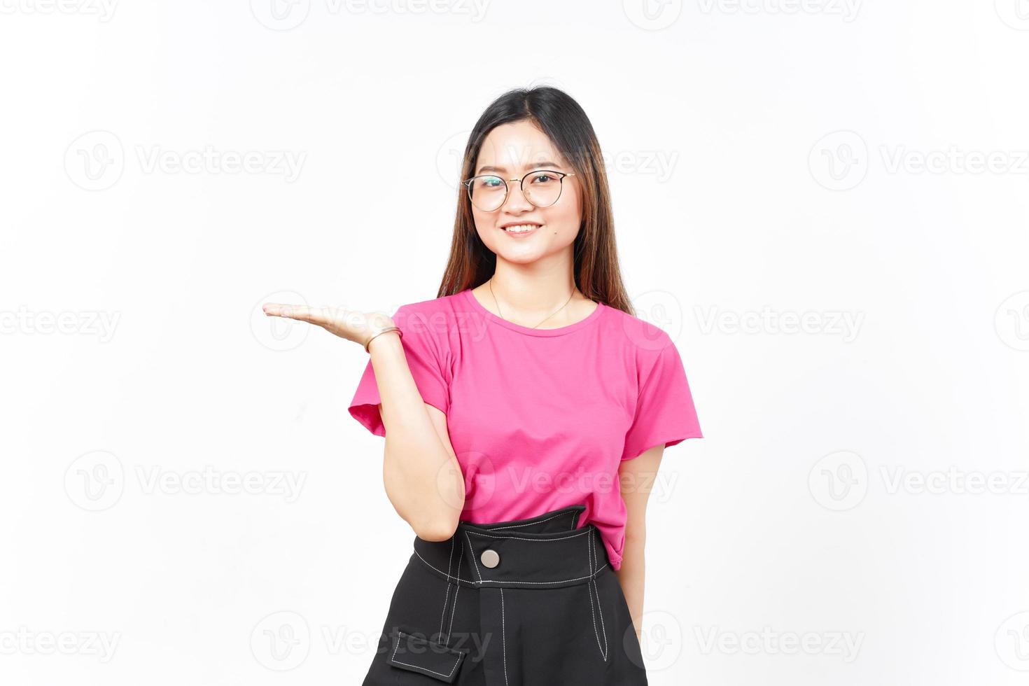 Showing and Presenting Product on Open Palm Of Beautiful Asian Woman Isolated On White Background photo