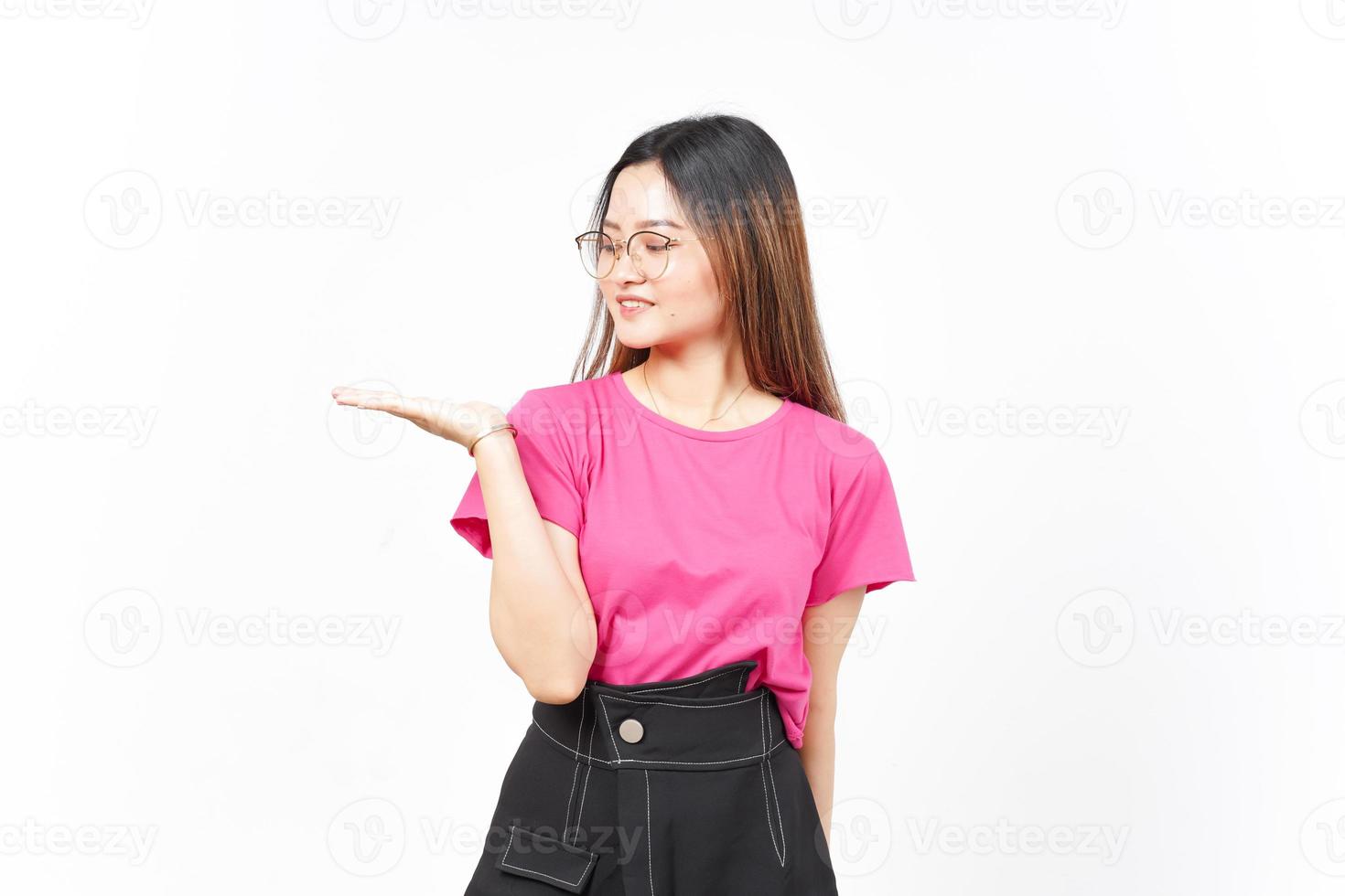 Showing and Presenting Product on Open Palm Of Beautiful Asian Woman Isolated On White Background photo