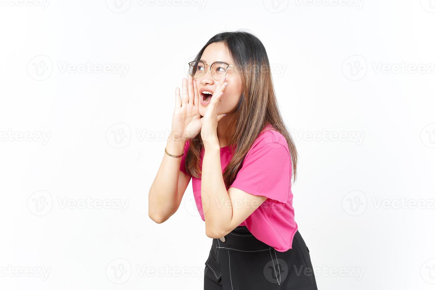 Announcement with hands over mouth Of Beautiful Asian Woman Isolated On White Background photo