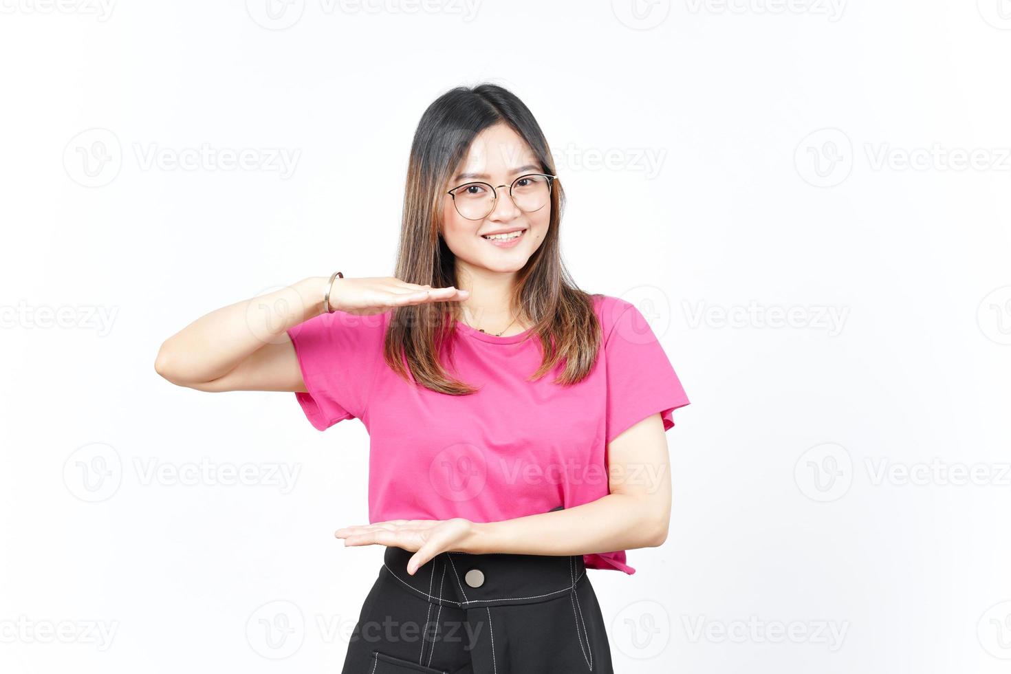 Measuring and Showing Big Sign Product Of Beautiful Asian Woman Isolated On White Background photo