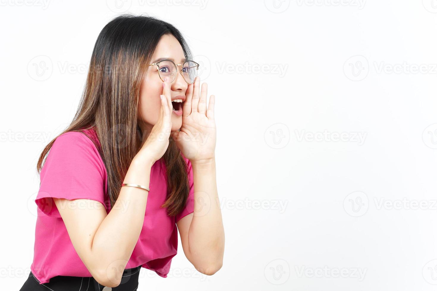 Announcement with hands over mouth Of Beautiful Asian Woman Isolated On White Background photo