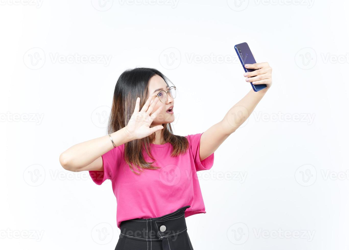 Take a Selfie using Smartphone Of Beautiful Asian Woman Isolated On White Background photo