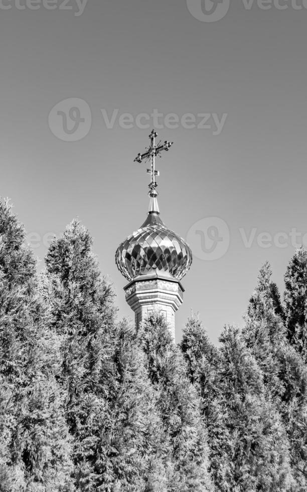 Christian church cross in high steeple tower for prayer photo