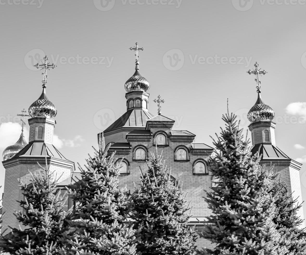 Christian church cross in high steeple tower for prayer photo
