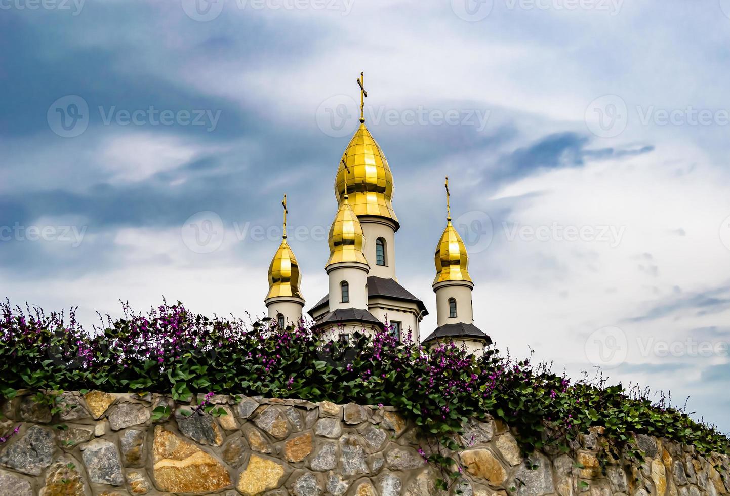 Christian church cross in high steeple tower for prayer photo
