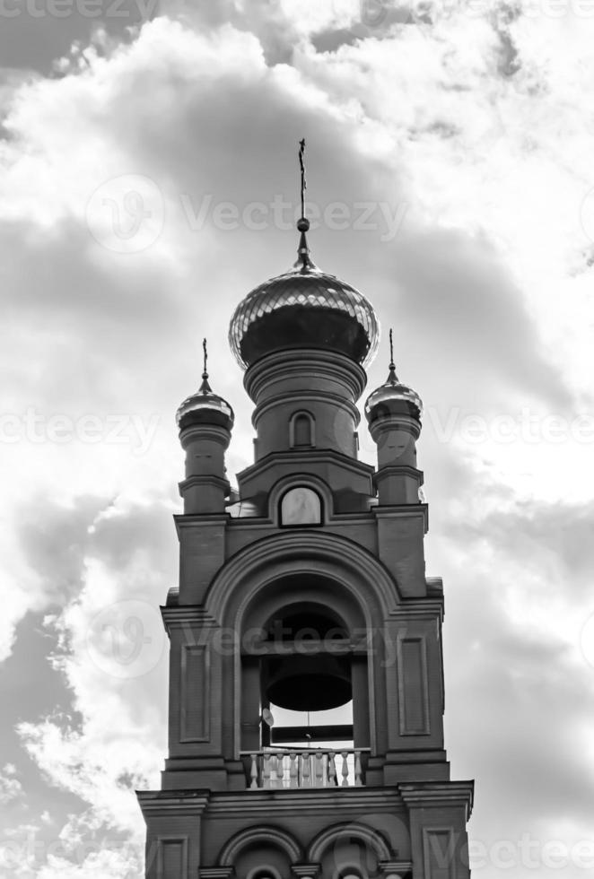 Christian church cross in high steeple tower for prayer photo