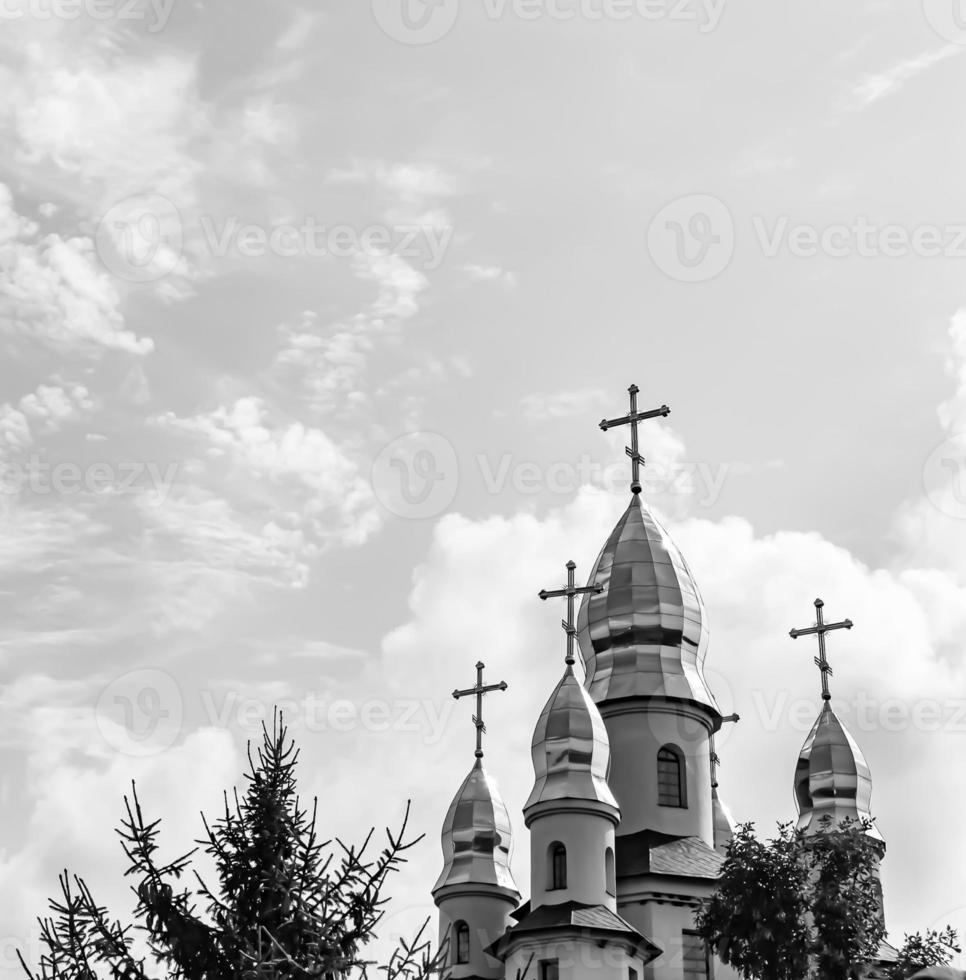 Christian church cross in high steeple tower for prayer photo