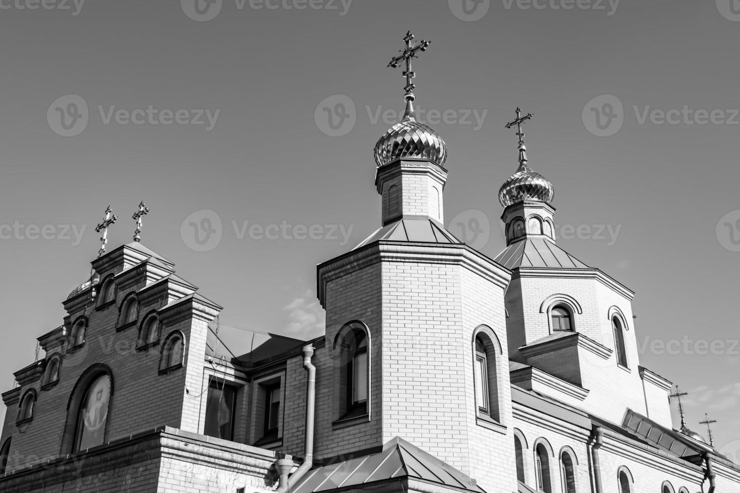 Christian church cross in high steeple tower for prayer photo