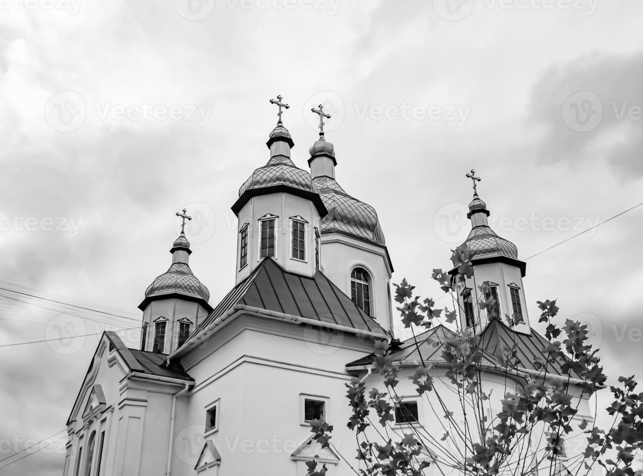 Christian church cross in high steeple tower for prayer photo