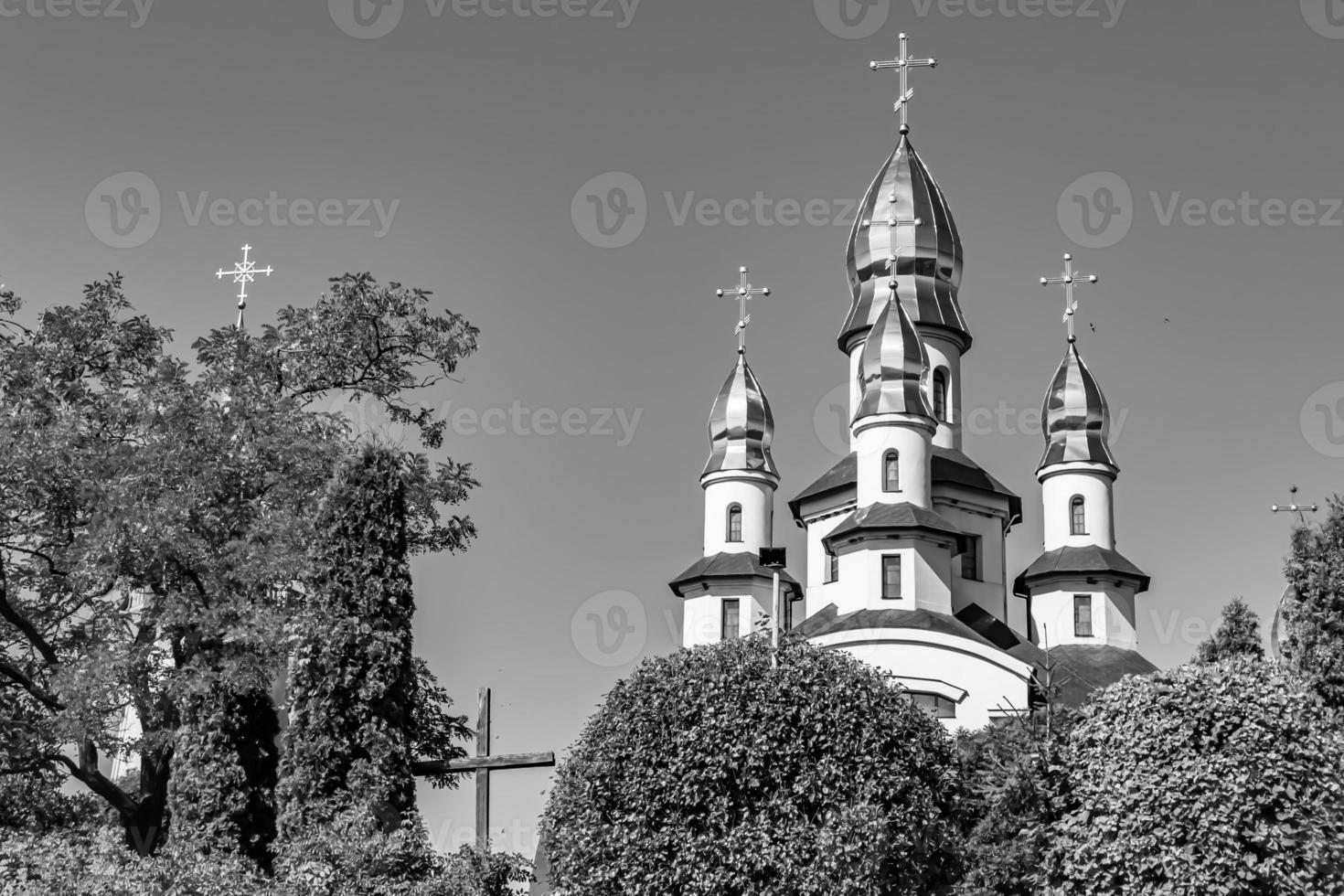 Christian church cross in high steeple tower for prayer photo