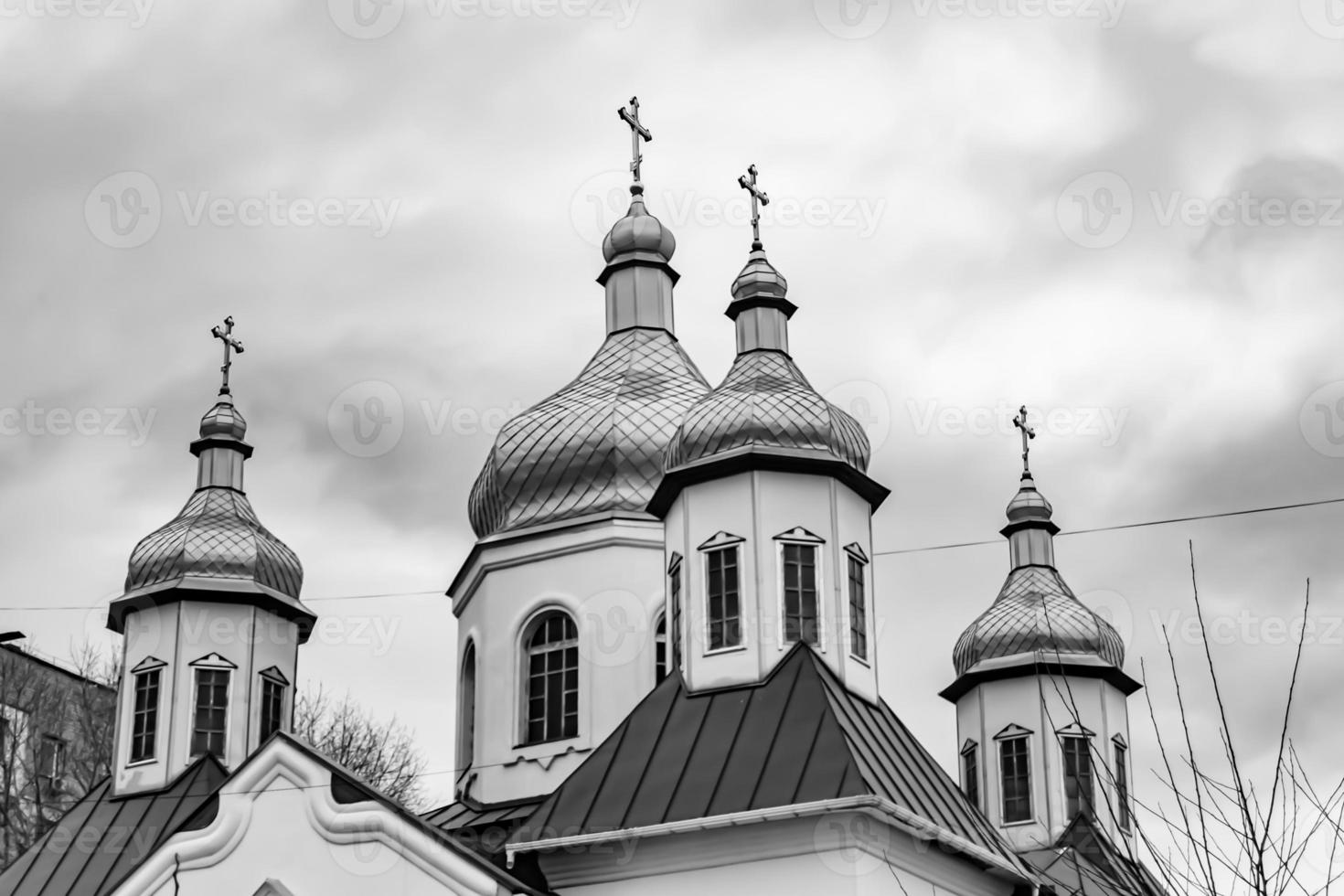 Christian church cross in high steeple tower for prayer photo