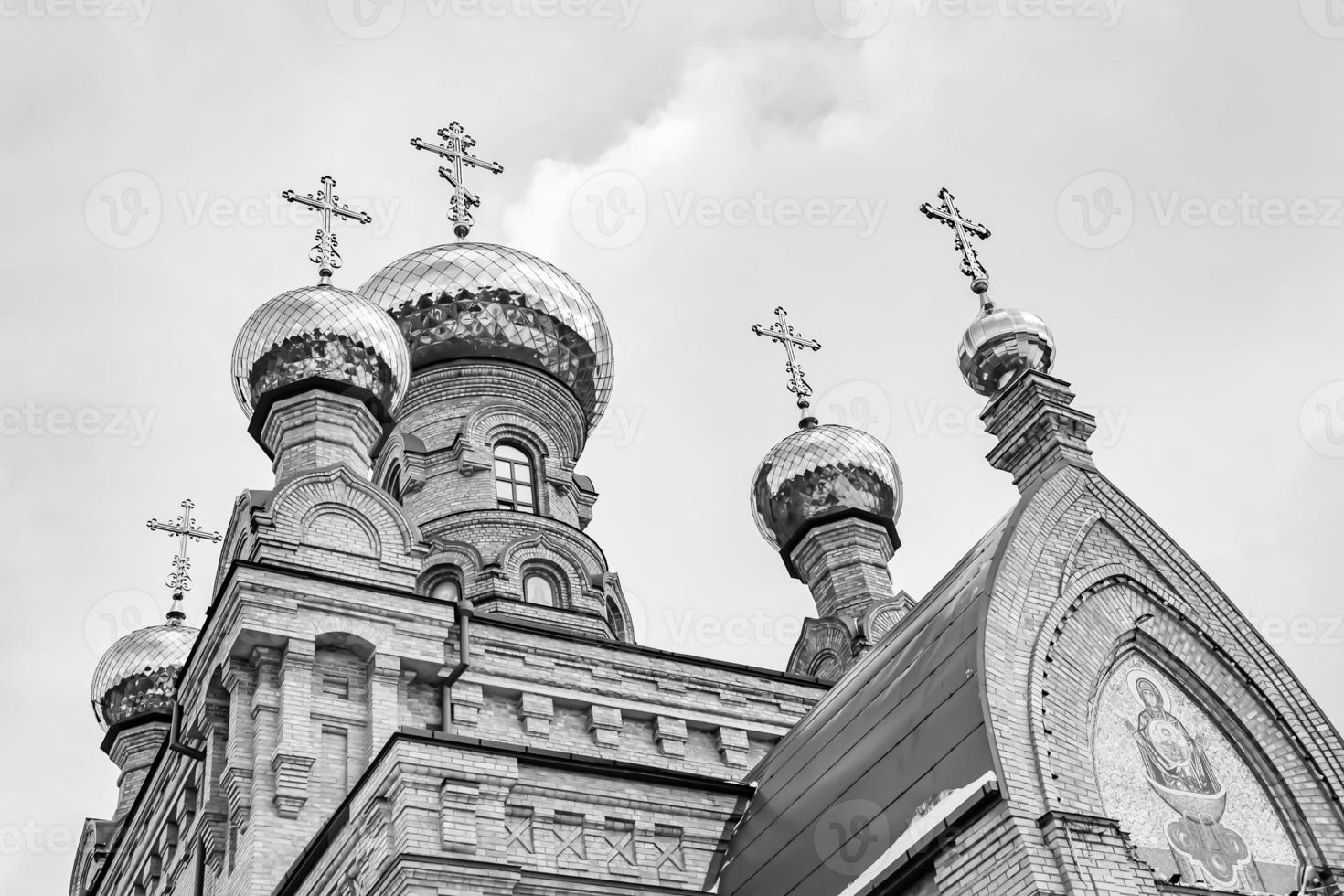 Christian church cross in high steeple tower for prayer photo