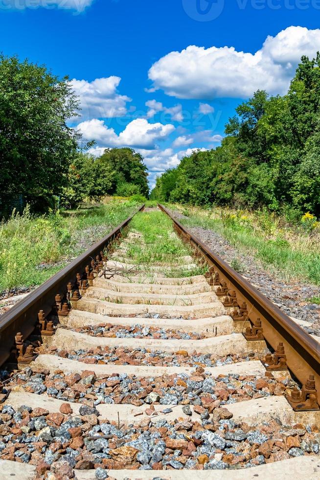 Photography to theme railway track after passing train on railroad photo