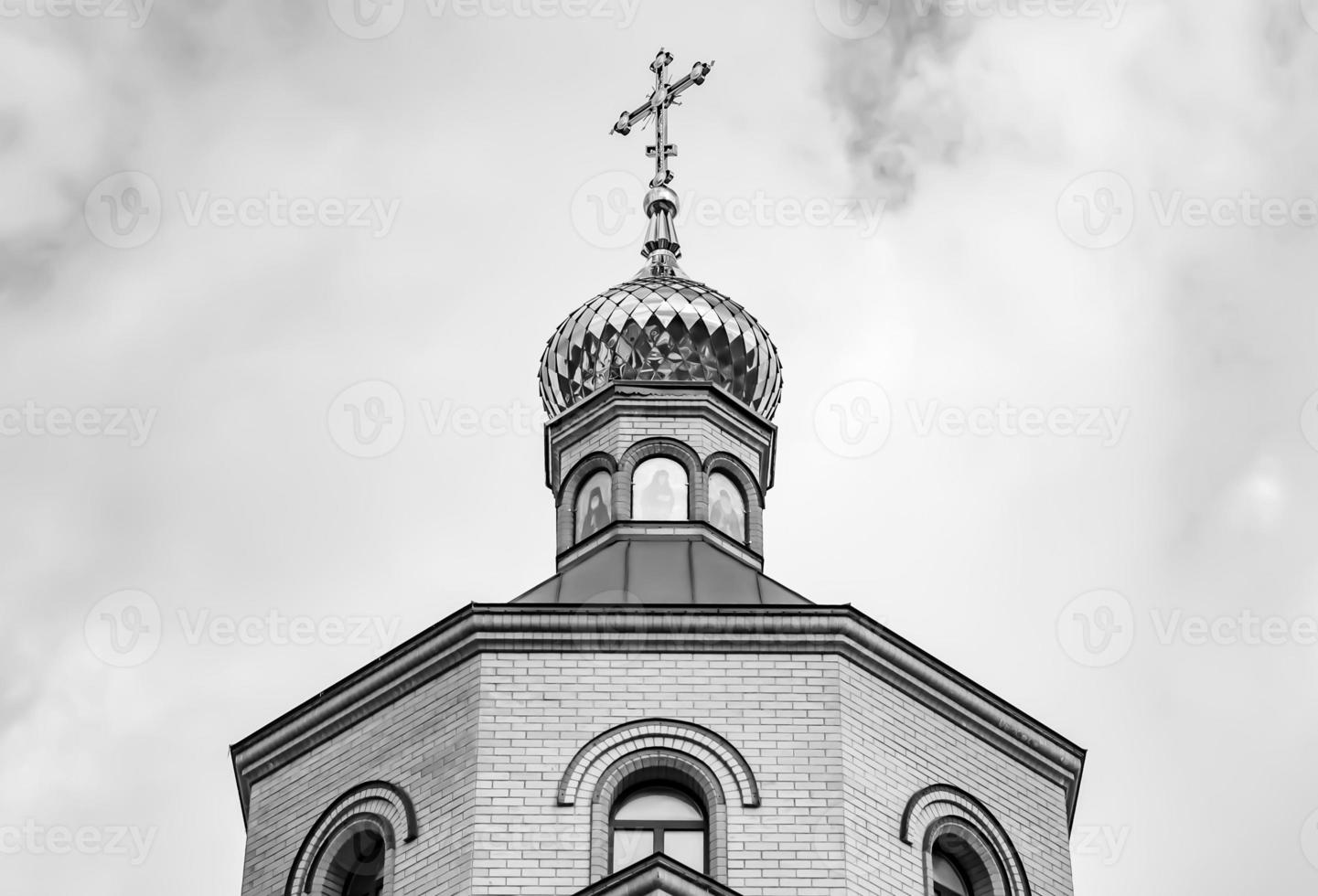 Christian church cross in high steeple tower for prayer photo