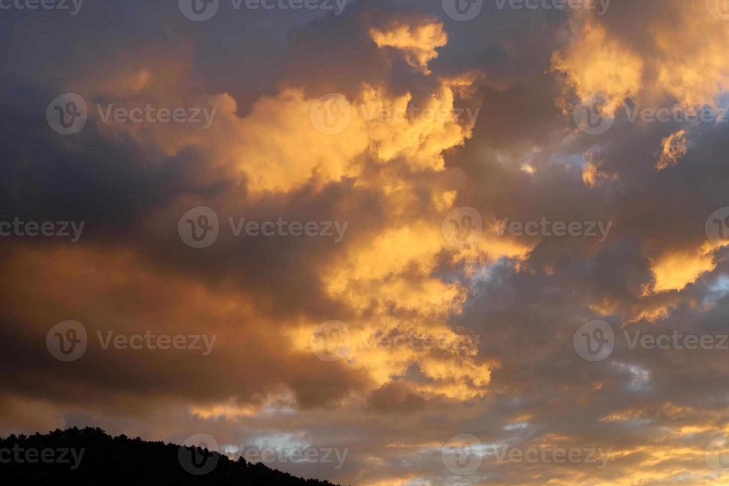 Rain clouds in the sky above the forest. photo