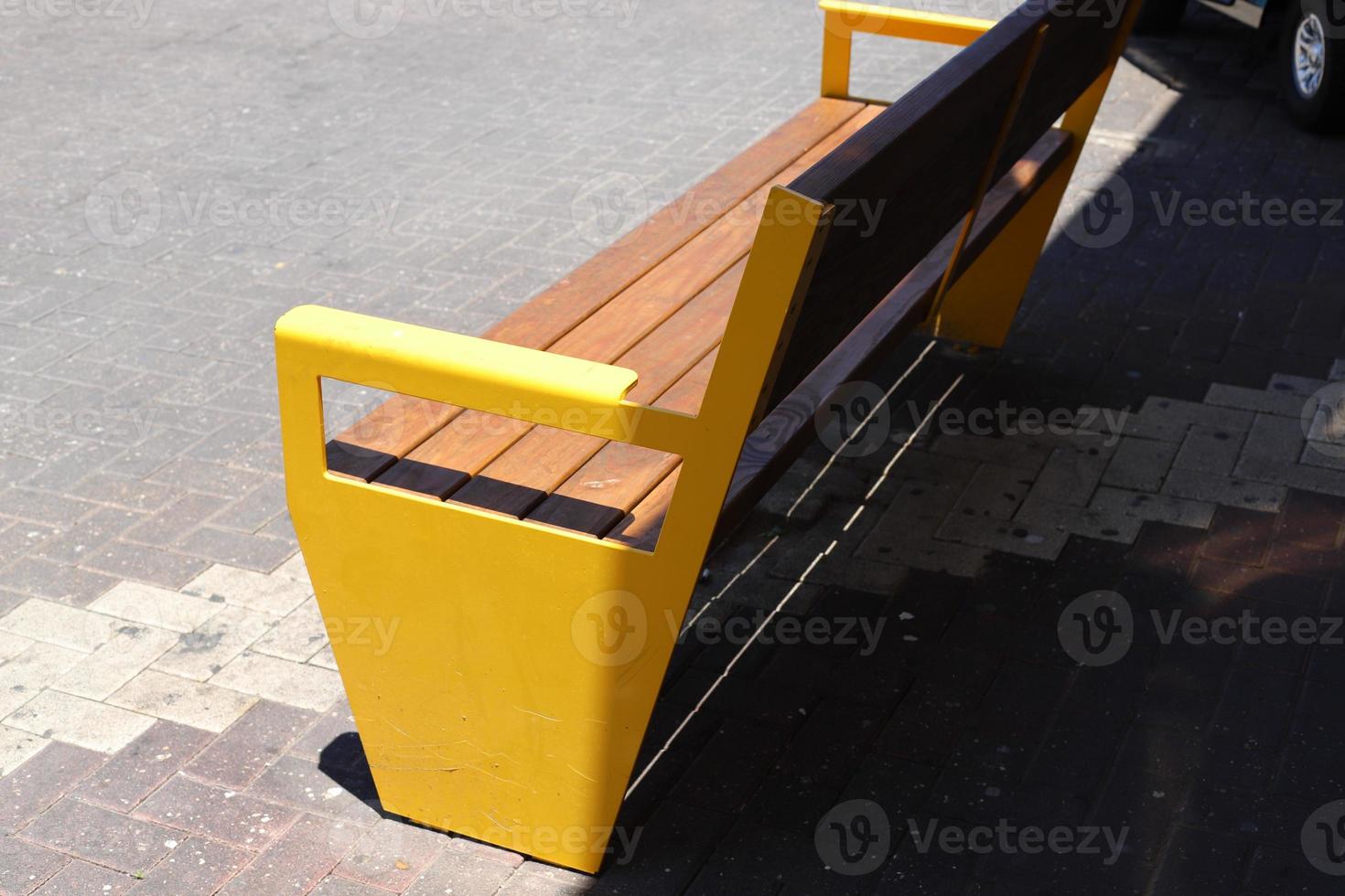 Bench for rest in the city park on the seashore. photo