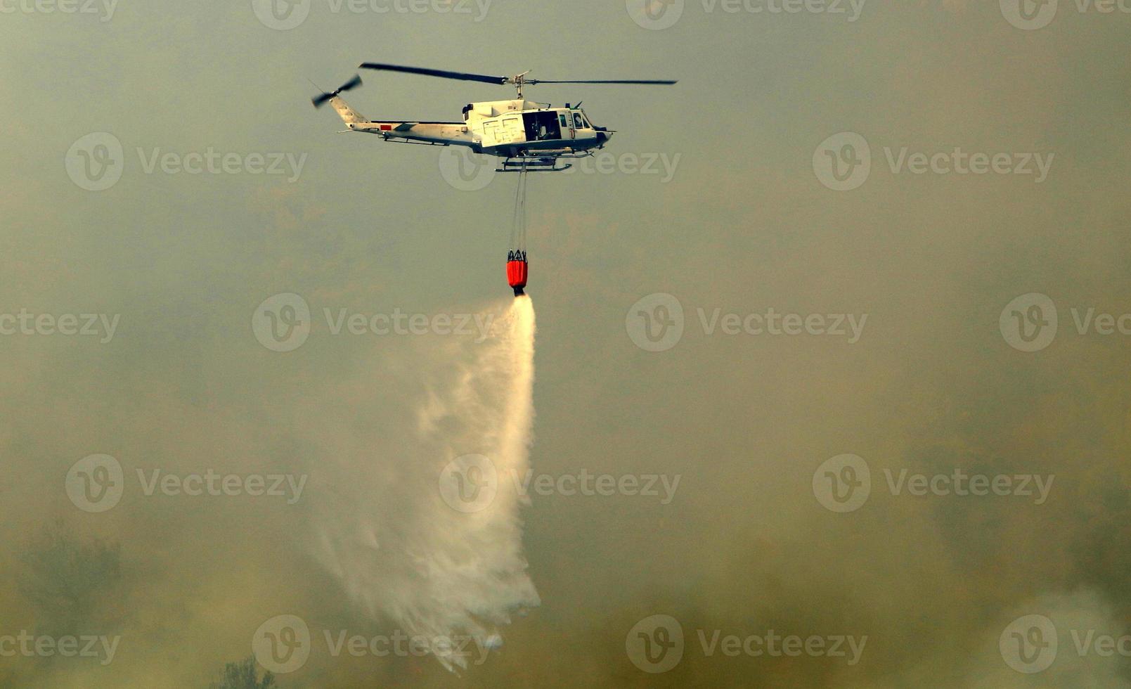 A helicopter puts out a forest fire in the mountains of northern Israel. photo