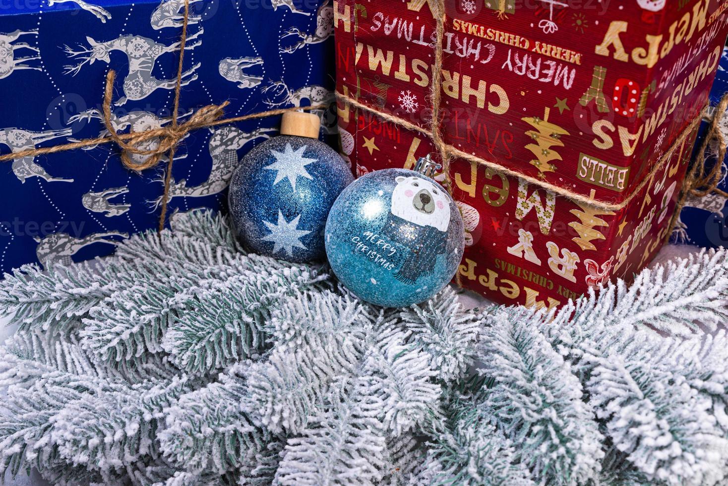 Creative diy craft hobby. Making handmade craft christmas ornaments and balls with felt spruce tree. christmas tree with colorful balls and gift boxes over white brick wall with blue and white balls photo