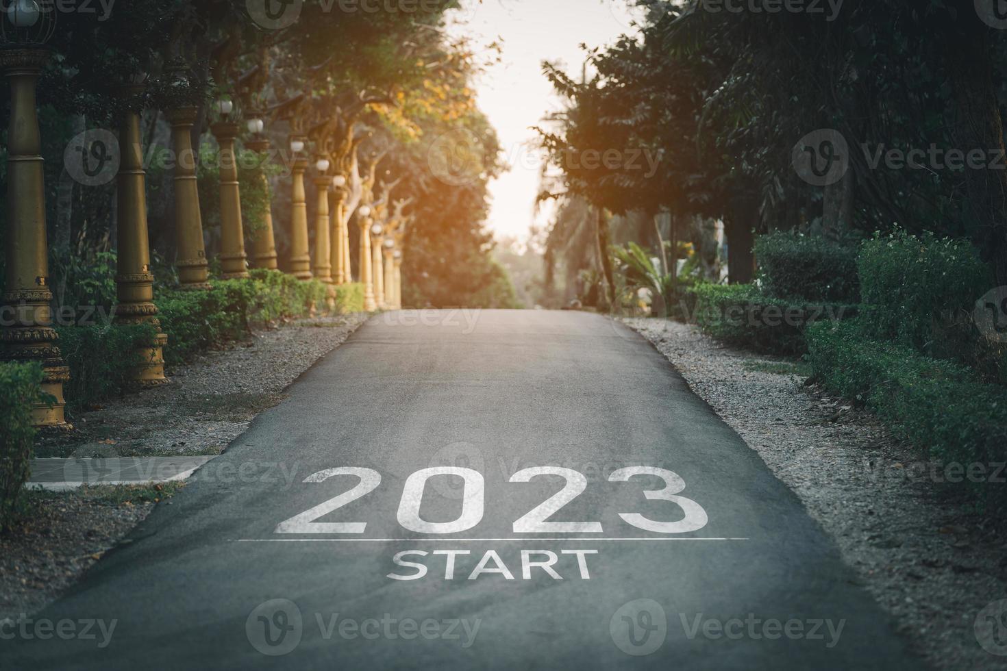 Happy new year 2023,2023 symbolizes the start of the new year. The letter start new year 2023 on the road in the nature garden park have tree environment ecology or greenery wallpaper concept. photo