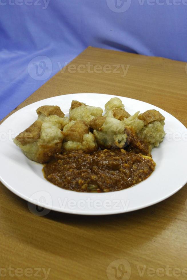 Batagor with peanut sauce on a plate photo