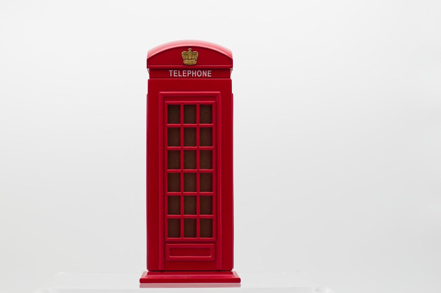 Red London Street Phone Booth Isolated on White Background. photo