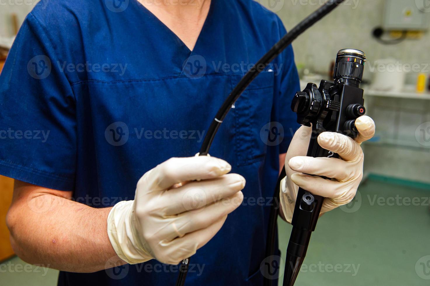 Endoscope in the hands of doctor. Medical instruments used in gastroscopy.Gastric probe photo