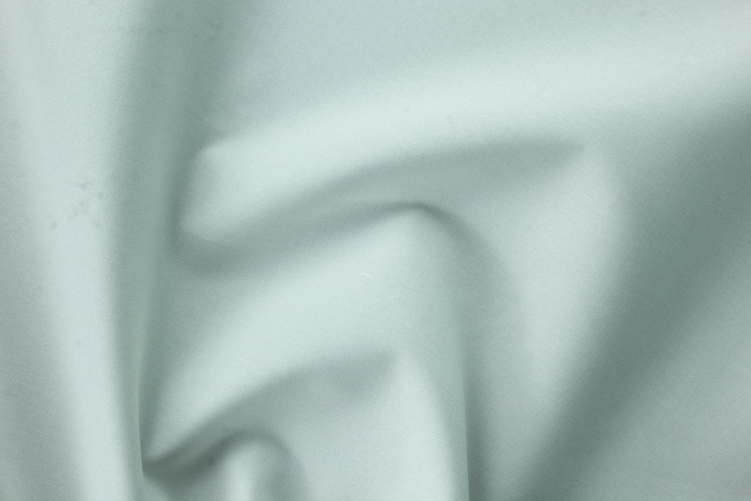 16 textura suave de algodón blanco, fondo de seda curva, patrón. textura de tela de seda blanca. hermosa seda suave esmeralda. foto