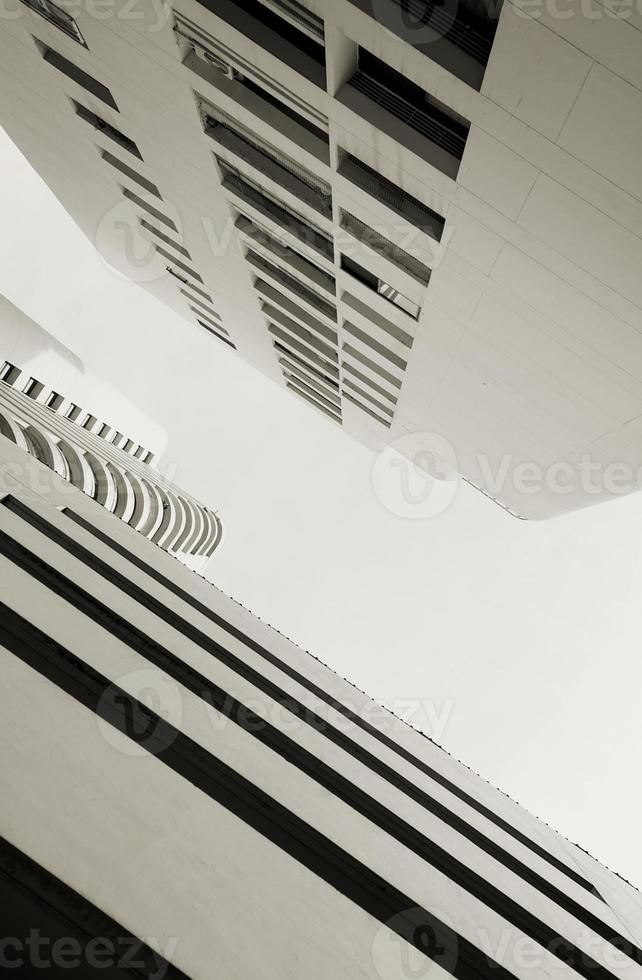 Beautiful high neutral white tower cosmopolitan residential urban condo, condominium, or modern flat buildings structure. photo