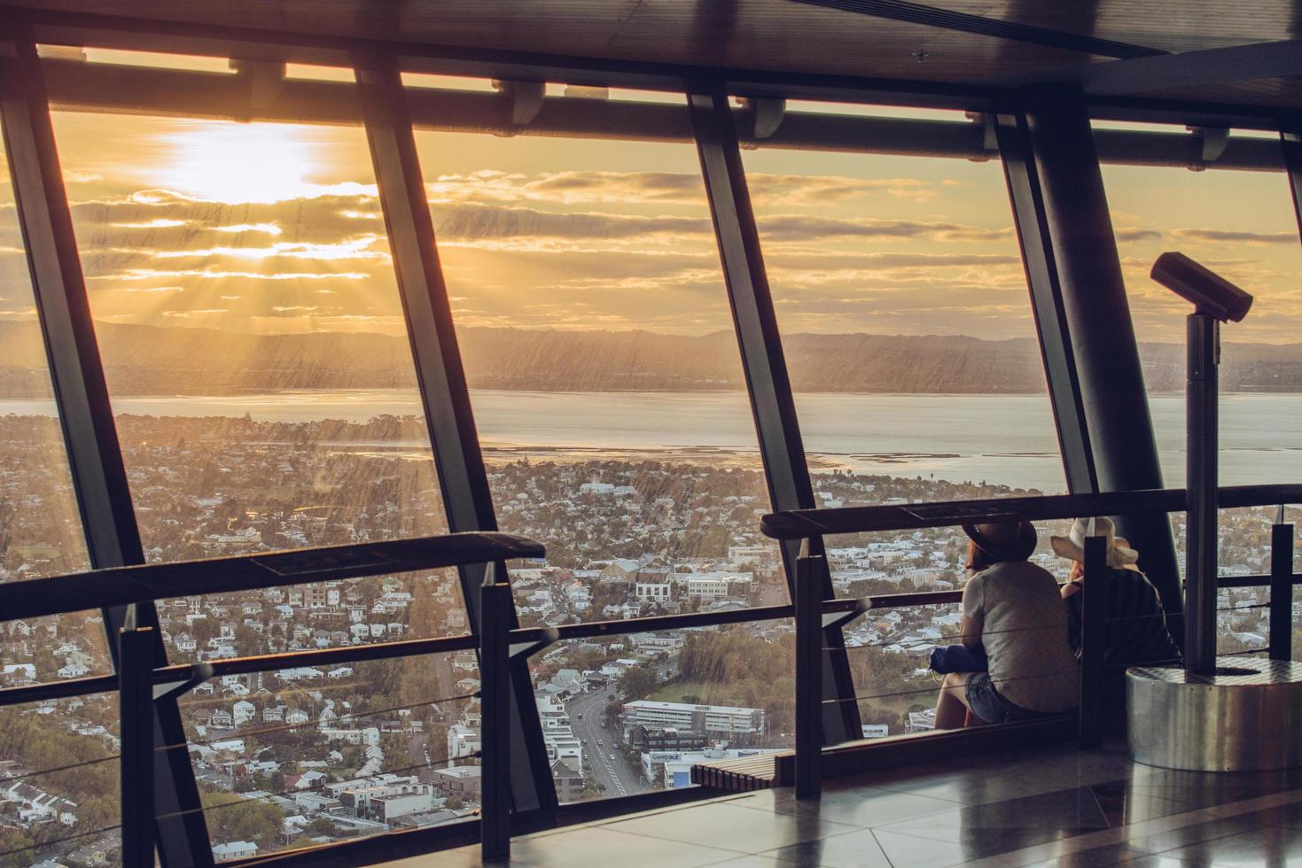 Auckland, New Zealand - March 03 2017 - Auckland cityscape during the sunset view from Auckland Sky Tower observation desk, New Zealand. photo