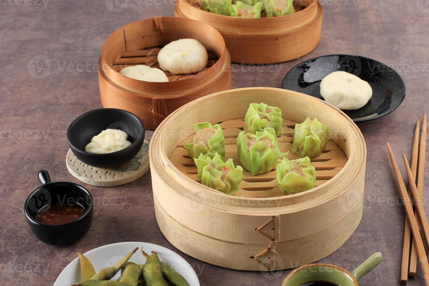 Vegetable Shumai with Green Skin Color, Steamed Dim Sum Dumpling photo