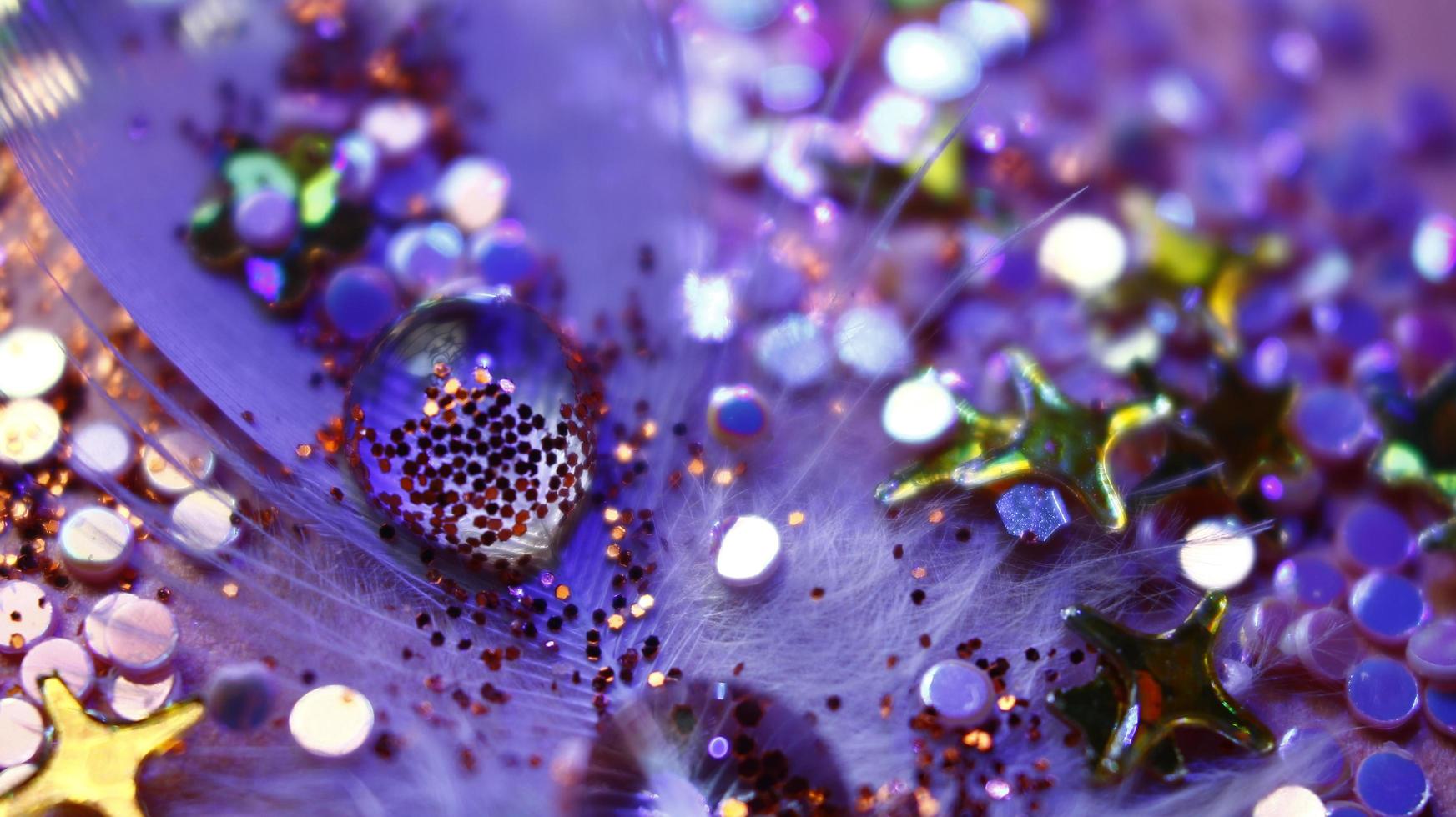 Close-up Of water drop with glitter on it in different colorful loghts in Karachi Pakistan 2022 photo