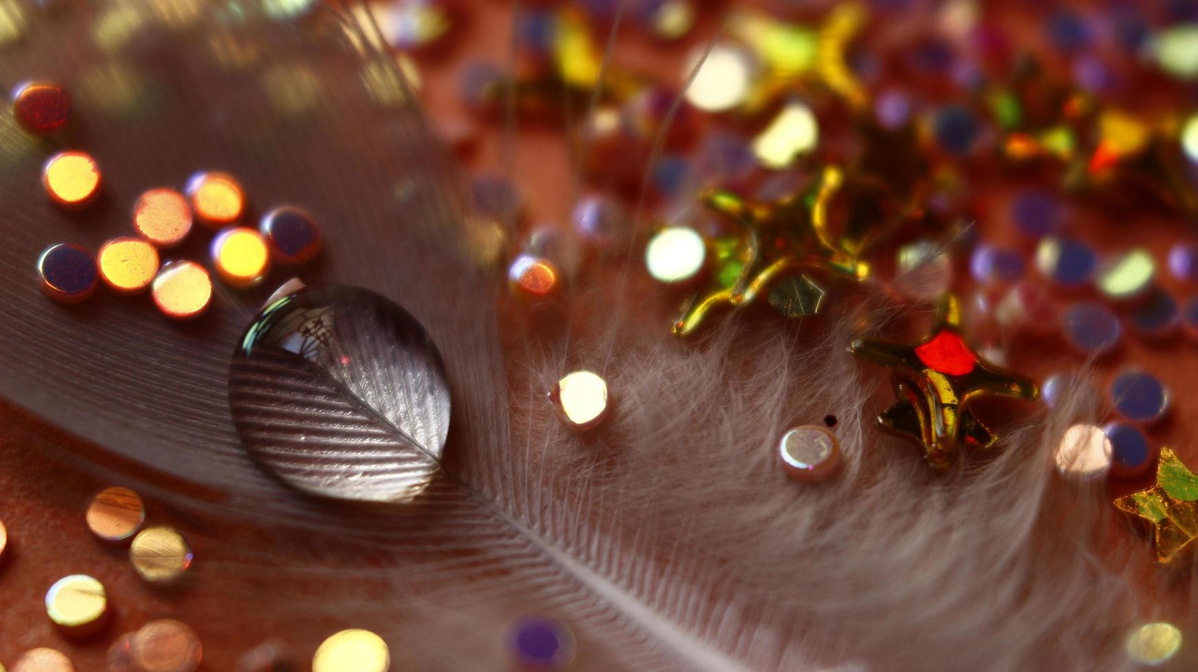 Close-up Of water drop with glitter on it in different colorful loghts in Karachi Pakistan 2022 photo