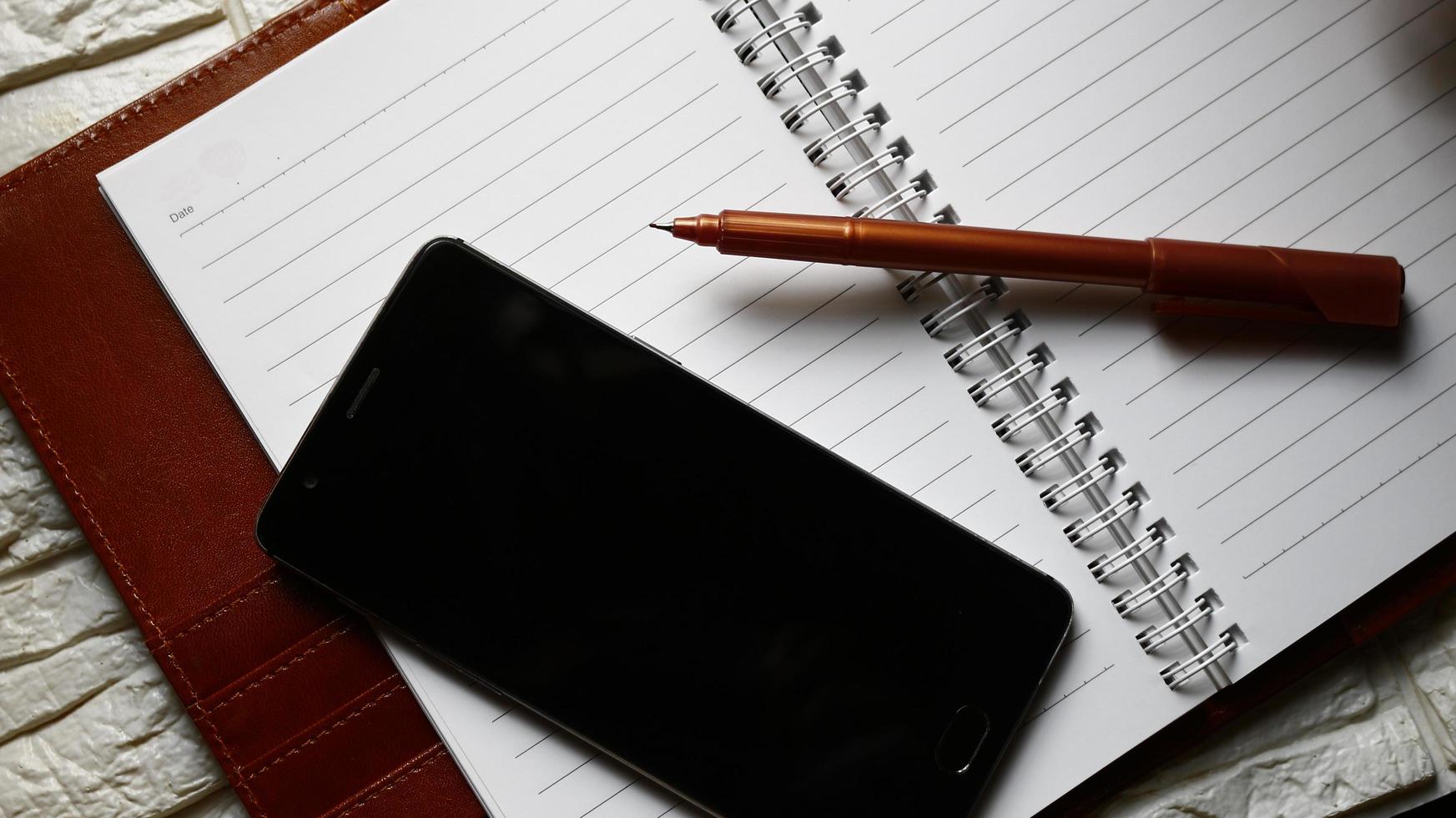 Work Bag And Office Diary On Table in Karachi Pakistan 2022 photo