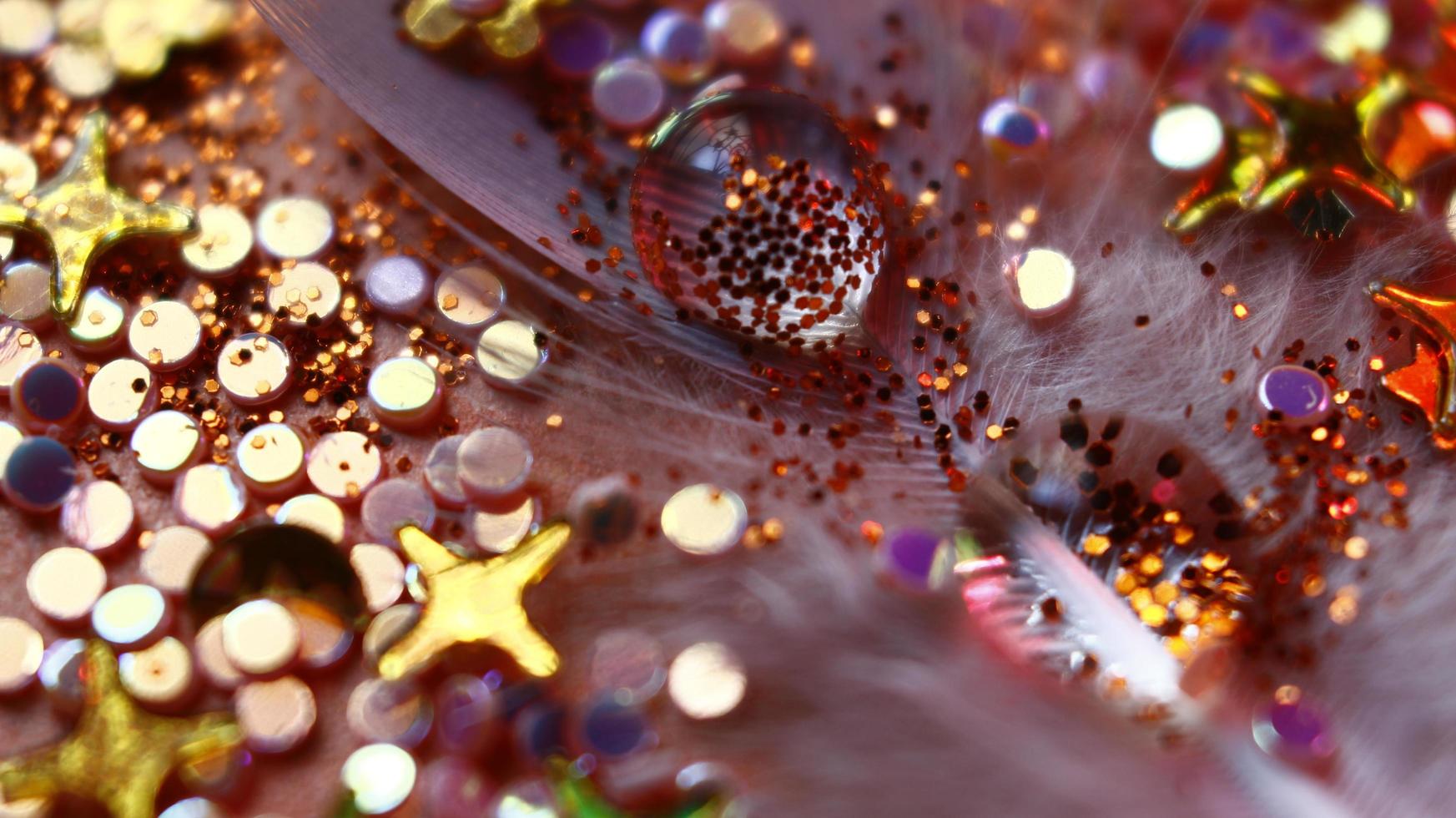 Close-up Of water drop with glitter on it in different colorful loghts in Karachi Pakistan 2022 photo