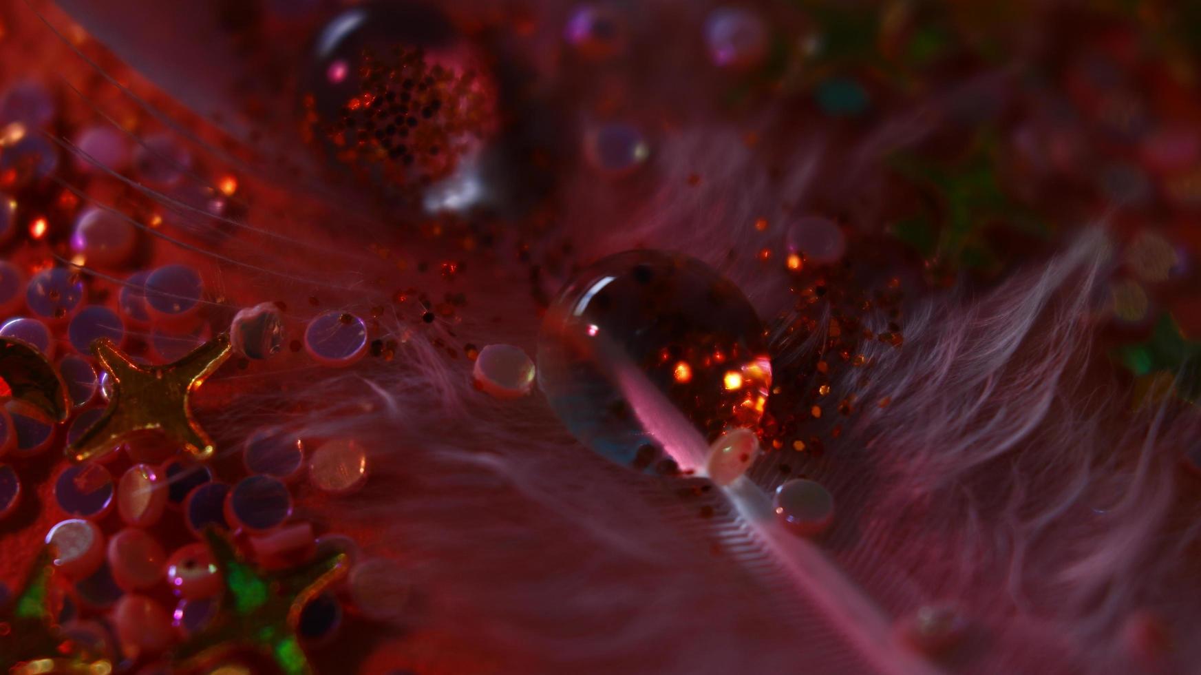 Close-up Of water drop with glitter on it in different colorful loghts in Karachi Pakistan 2022 photo