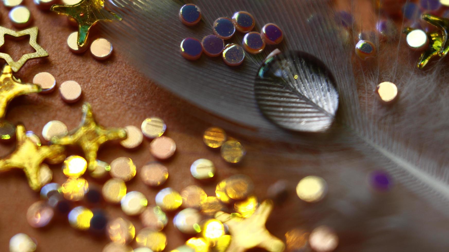 Close-up Of water drop with glitter on it in different colorful loghts in Karachi Pakistan 2022 photo