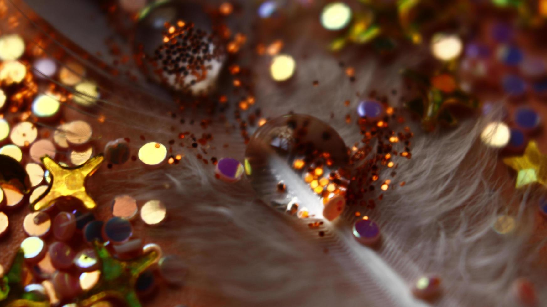 Close-up Of water drop with glitter on it in different colorful loghts in Karachi Pakistan 2022 photo