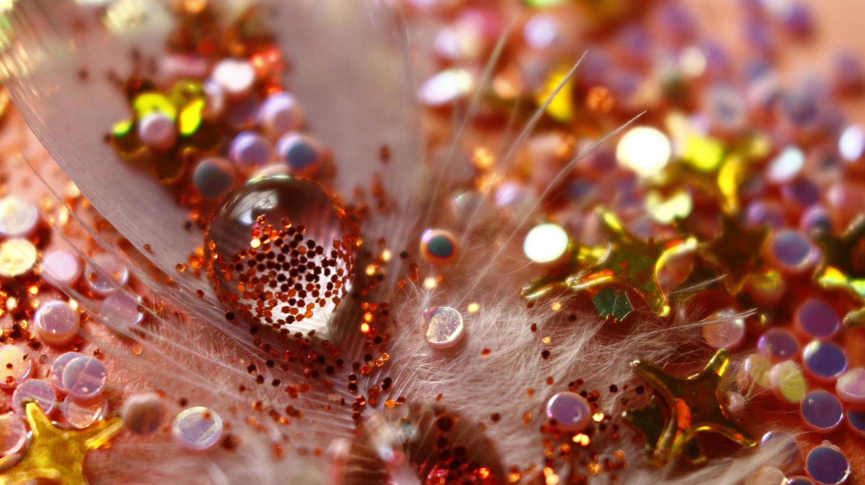 Close-up Of water drop with glitter on it in different colorful loghts in Karachi Pakistan 2022 photo