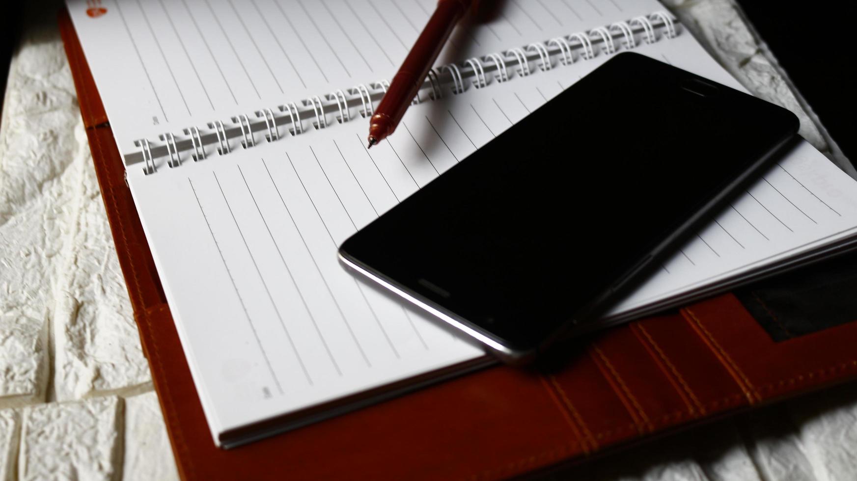 Work Bag And Office Diary On Table in Karachi Pakistan 2022 photo