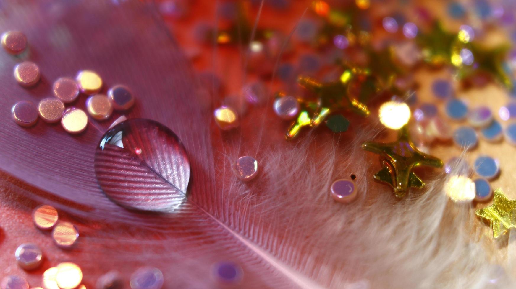 Close-up Of water drop with glitter on it in different colorful loghts in Karachi Pakistan 2022 photo