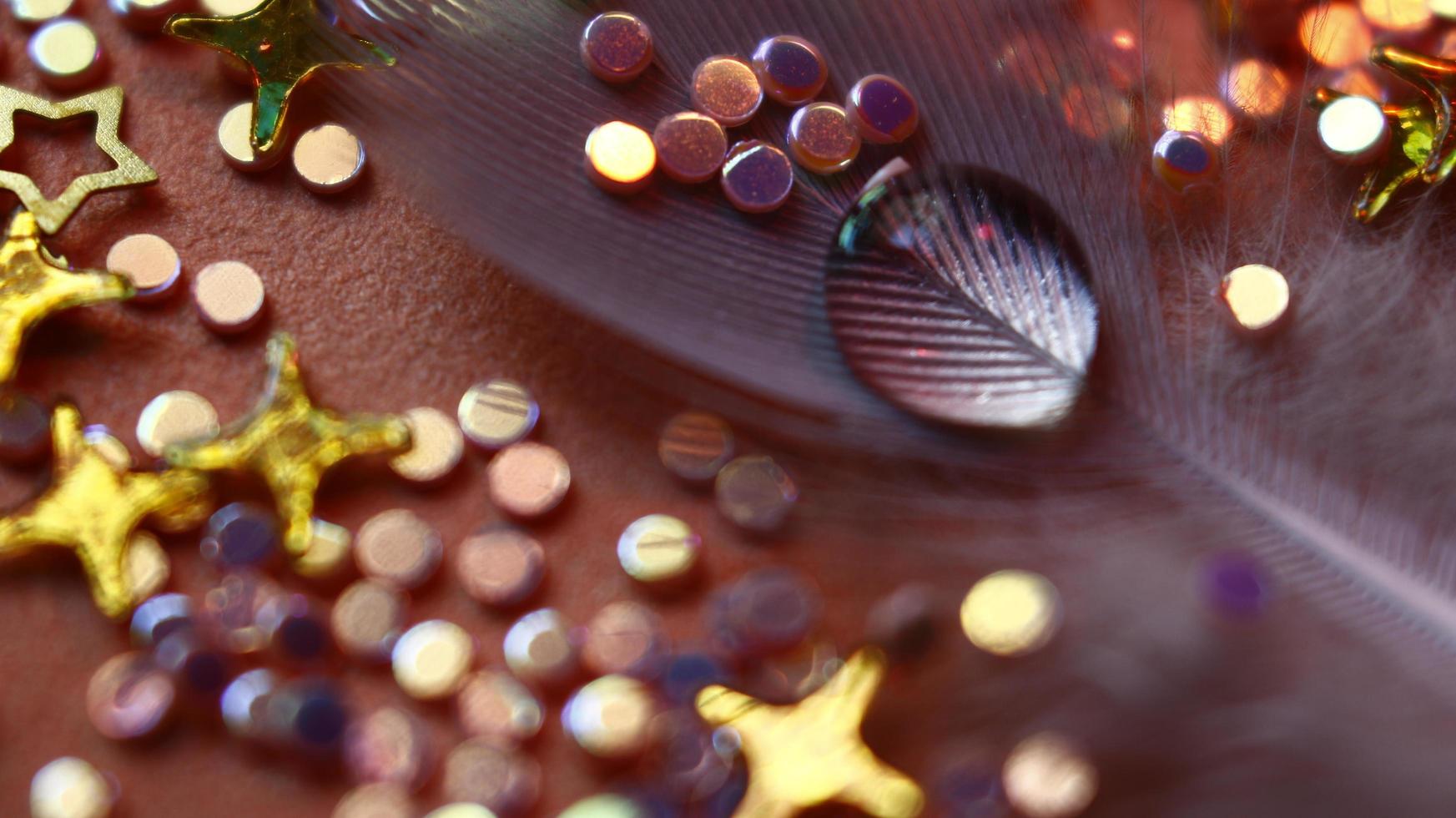 Close-up Of water drop with glitter on it in different colorful loghts in Karachi Pakistan 2022 photo
