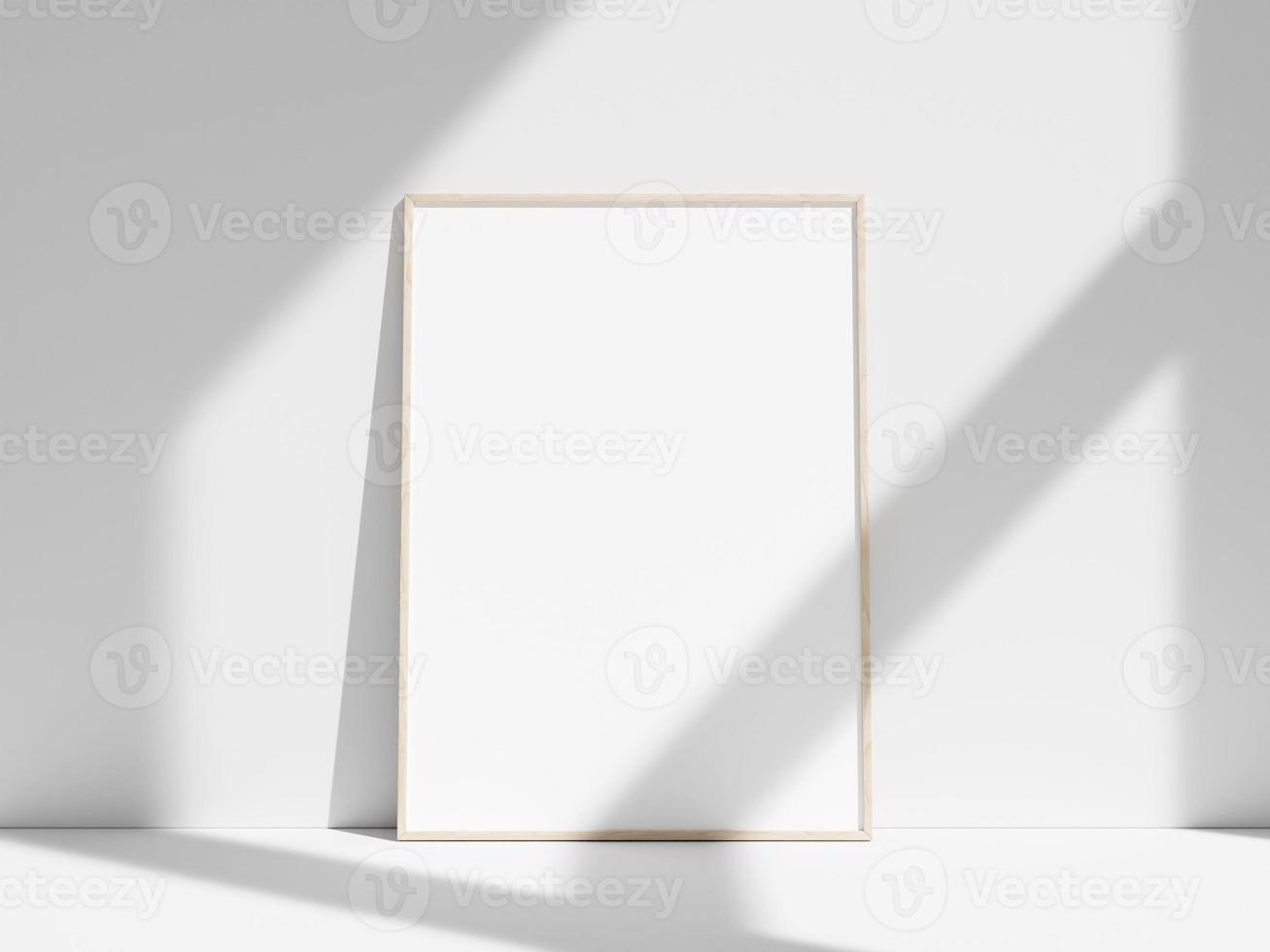 Empty frame on the white wall with window shadow photo