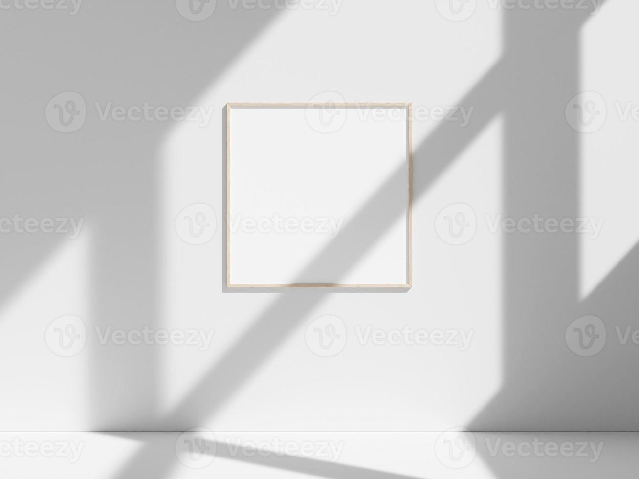 Empty frame on the white wall with window shadow photo