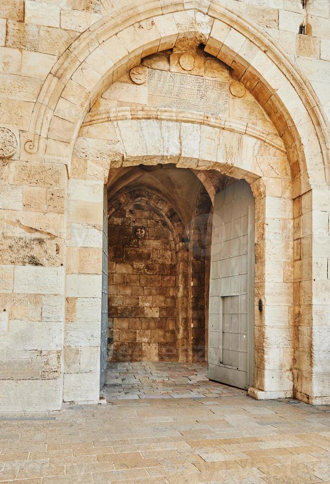 View of the Jaffa Gate in Jerusalem. The old gate has the shape of a medieval gate tower with an L-shaped entryway, which was secured at both ends with heavy doors photo