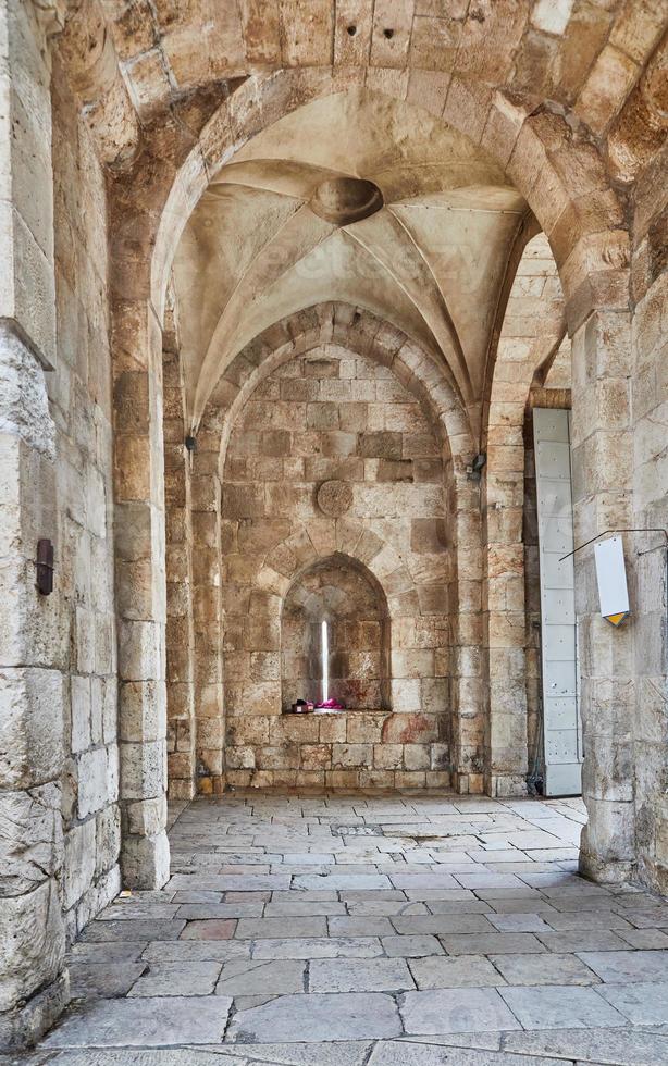 View of the Jaffa Gate in Jerusalem. The old gate has the shape of a medieval gate tower with an L-shaped entryway, which was secured at both ends with heavy doors photo