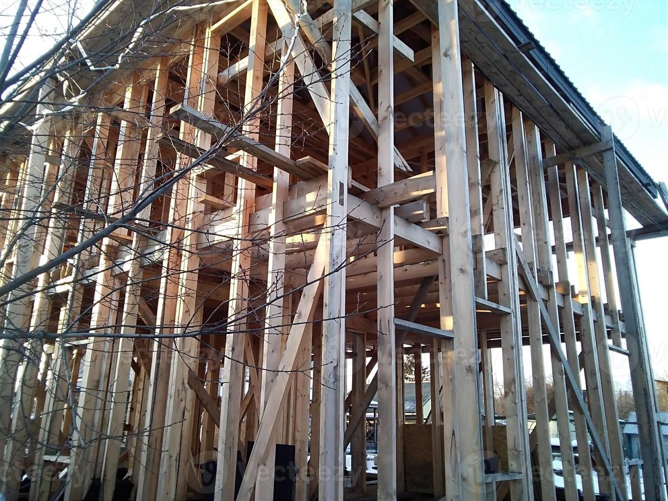 Panoramic interior view of a wooden timber frame from a new house under construction photo
