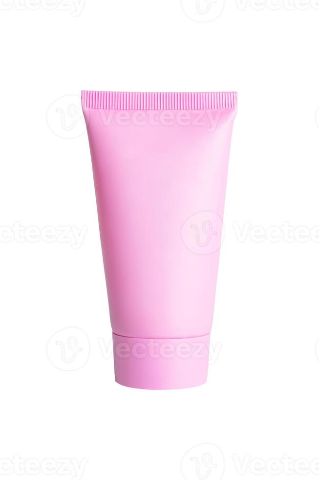 Pink plastic cream or mask or shampoo tube isolated on white background by clipping path. Skin care madicine and cosmetology mockup photo