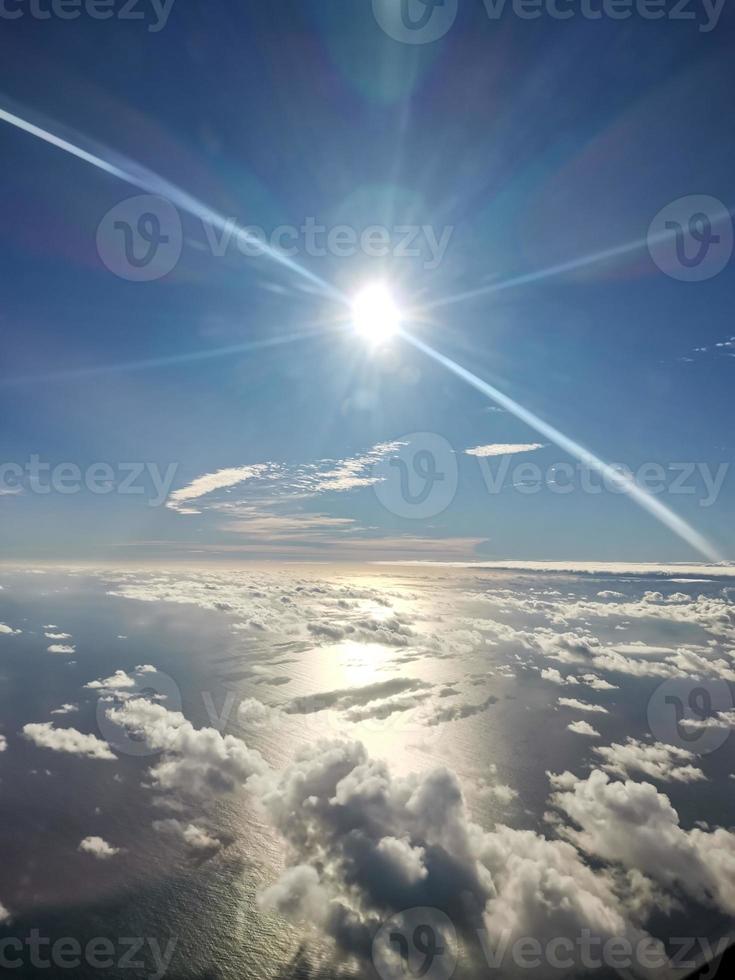 Shining sun with glare on background of horizon photo