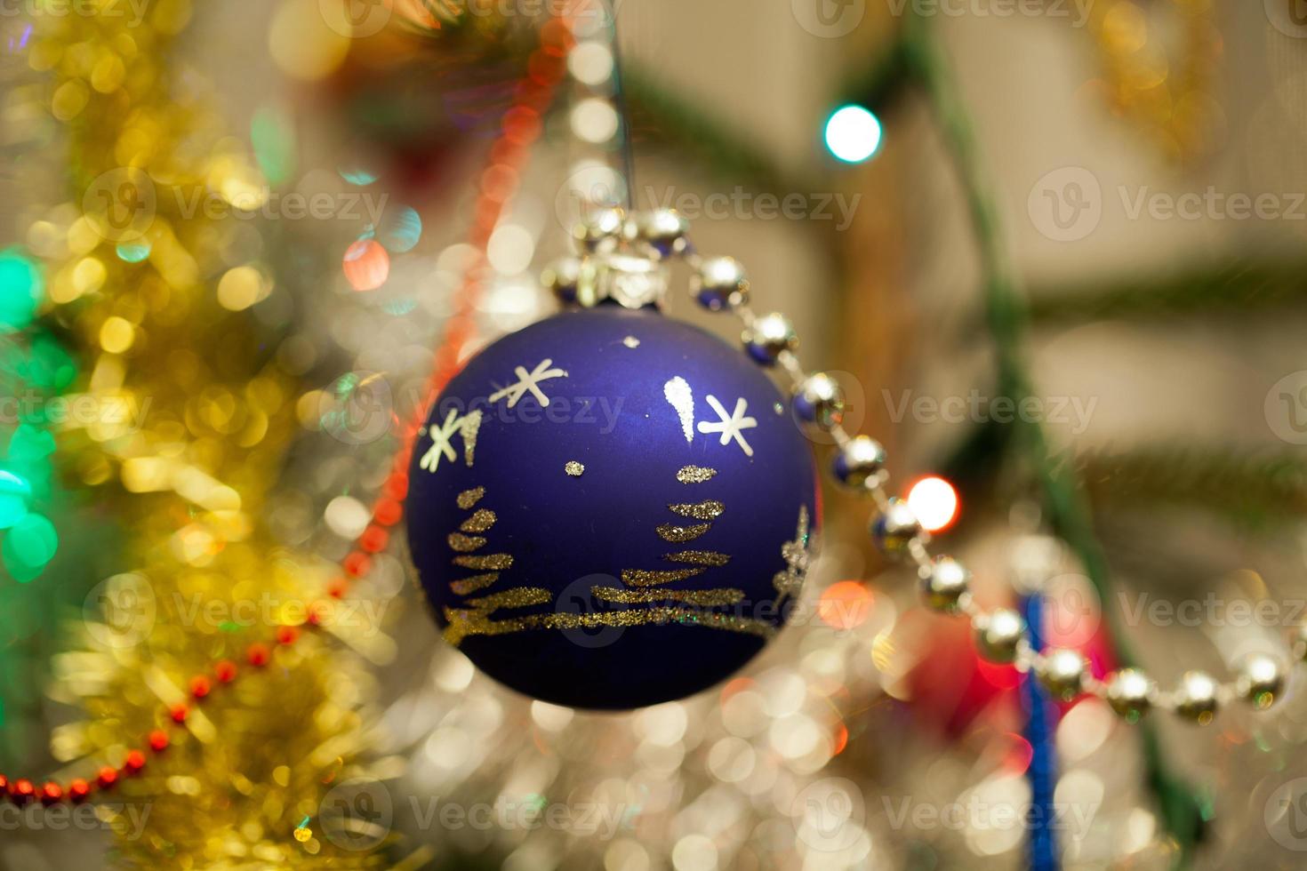 Christmas bauble on christmas tree photo