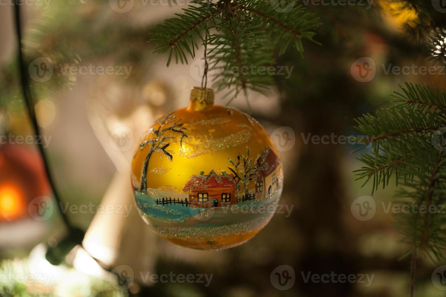Christmas bauble on christmas tree photo